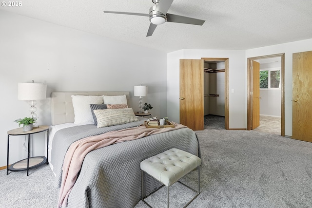 2111 NE 149th Ave, Vancouver, WA 98684 - carpeted bedroom with a spacious closet, a textured ceiling, baseboards, and a ceiling fan