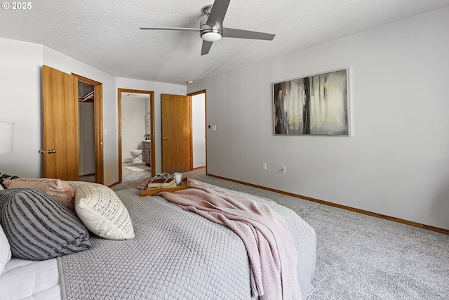 2111 NE 149th Ave, Vancouver, WA 98684 - bedroom featuring carpet flooring, baseboards, connected bathroom, a textured ceiling, and ceiling fan