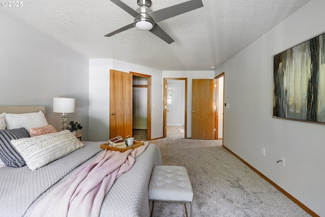 2111 NE 149th Ave, Vancouver, WA 98684 - carpeted bedroom featuring a textured ceiling, a walk in closet, a ceiling fan, and baseboards