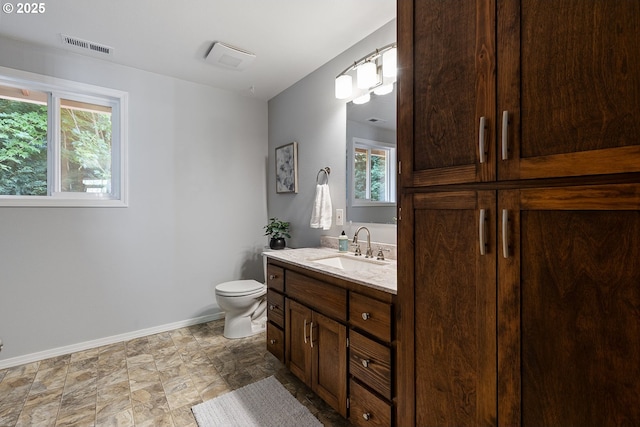 2111 NE 149th Ave, Vancouver, WA 98684 - bathroom featuring vanity, baseboards, and toilet