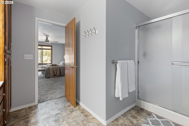 2111 NE 149th Ave, Vancouver, WA 98684 - bathroom with ensuite bath, a stall shower, baseboards, ceiling fan, and a textured ceiling