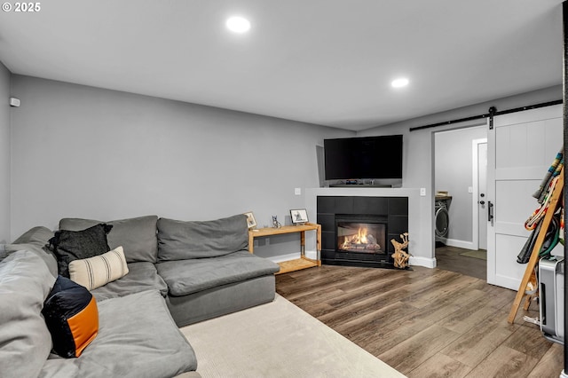 10417 NE 86th Ave, Vancouver, WA 98662 - living room with a barn door, wood finished floors, recessed lighting, and a fireplace