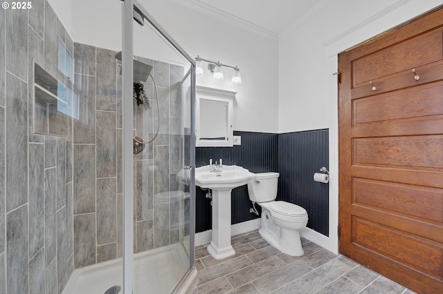 2309 7th St, Tillamook, OR 97141 - full bath featuring toilet, a shower stall, ornamental molding, and a wainscoted wall
