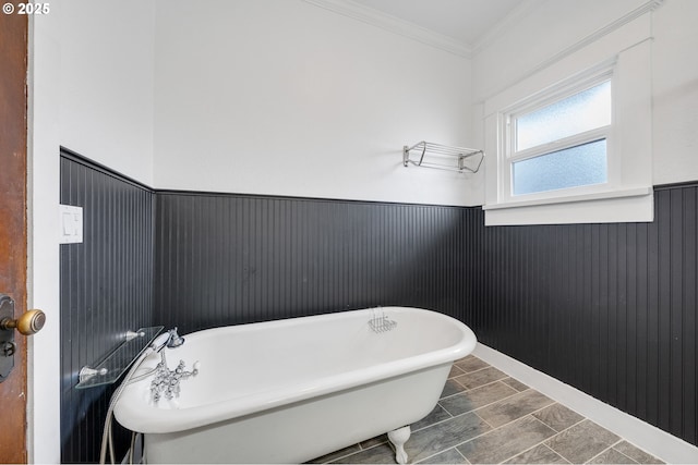 2309 7th St, Tillamook, OR 97141 - bathroom with a wainscoted wall, a soaking tub, and crown molding