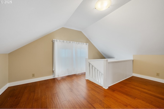 2309 7th St, Tillamook, OR 97141 - additional living space with wood-type flooring, vaulted ceiling, and baseboards