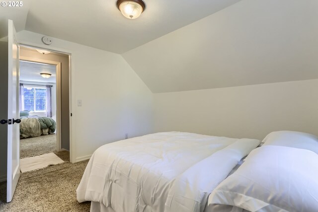6540 SE 88th Ave, Portland, OR 97266 - bedroom featuring carpet floors, lofted ceiling, and baseboards
