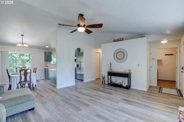 1185 Shady Ln, Keizer, OR 97303 - living room featuring arched walkways, a ceiling fan, vaulted ceiling, light wood-style flooring, and recessed lighting