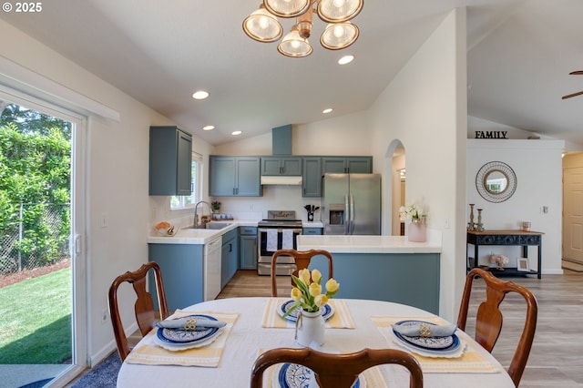 1185 Shady Ln, Keizer, OR 97303 - dining area featuring lofted ceiling, light wood-style flooring, recessed lighting, and a chandelier