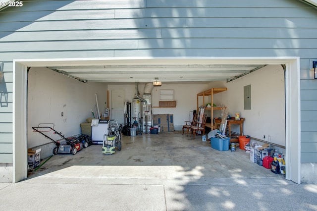 1185 Shady Ln, Keizer, OR 97303 - garage with electric panel, concrete driveway, and a garage door opener