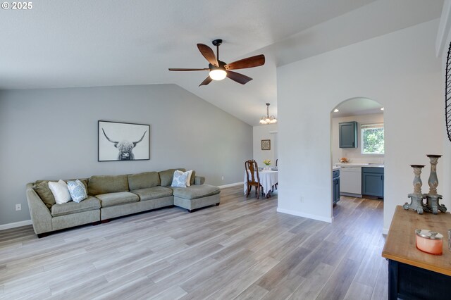 1185 Shady Ln, Keizer, OR 97303 - living area featuring ceiling fan, arched walkways, vaulted ceiling, and light wood-type flooring
