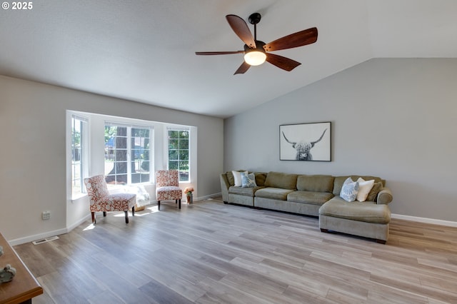 1185 Shady Ln, Keizer, OR 97303 - living room featuring vaulted ceiling, ceiling fan, and light wood-style floors