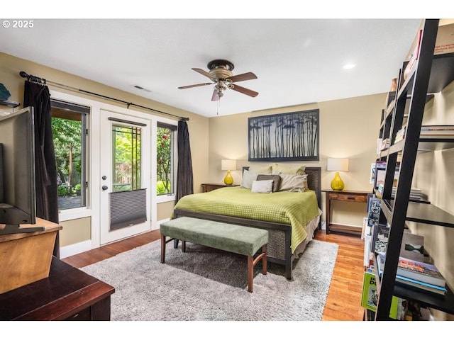 bedroom with ceiling fan, access to exterior, recessed lighting, wood finished floors, and visible vents