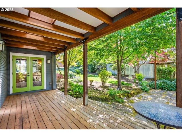 wooden terrace with fence and french doors