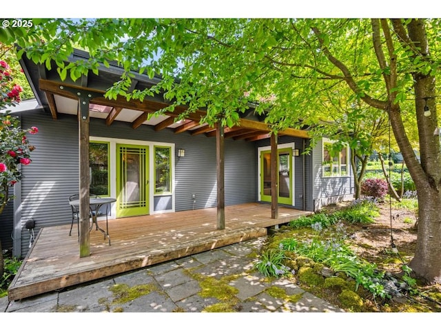 back of house featuring a deck