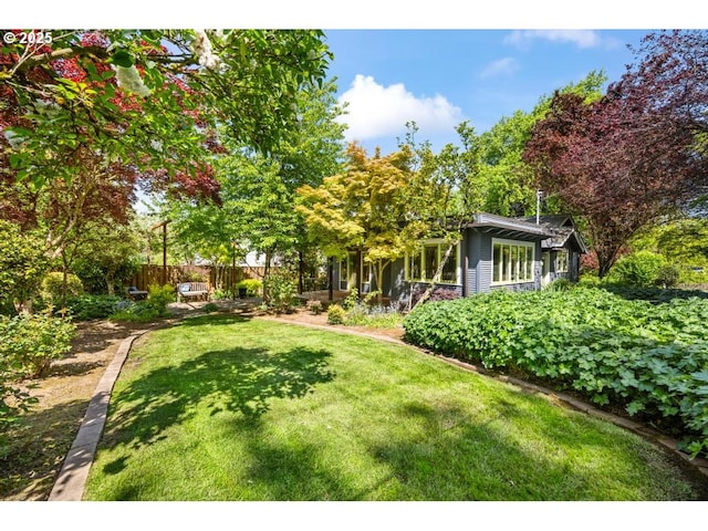 view of yard featuring fence