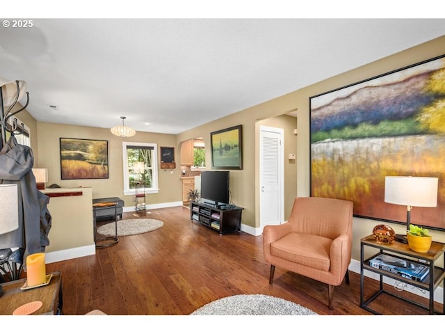 living room with baseboards and hardwood / wood-style flooring
