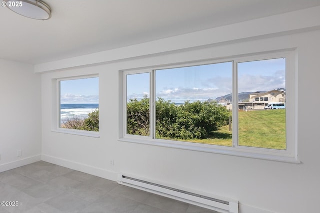 3929 NW Jetty Ave Unit 5, Lincoln City, OR 97367 - spare room featuring baseboard heating, healthy amount of natural light, and baseboards