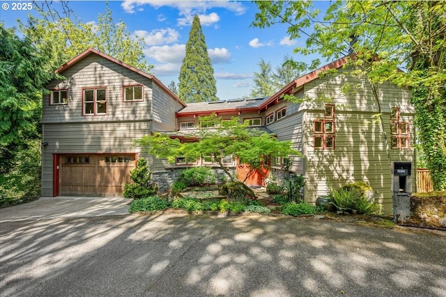 4908 SW Barnes Rd, Portland, OR 97221 - view of front of home featuring a garage and driveway