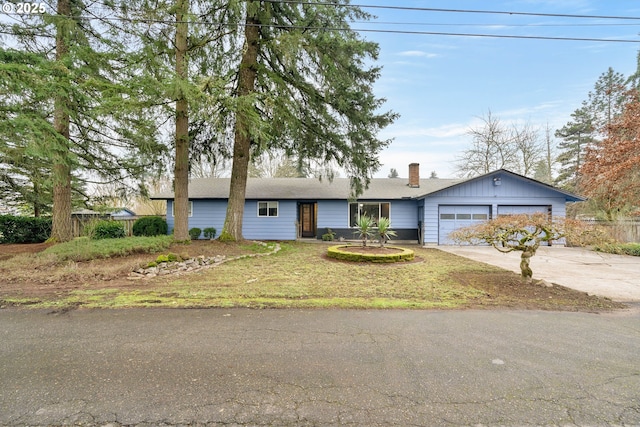 single story home with a front lawn and a garage