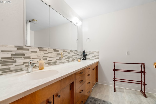 bathroom with vanity and backsplash