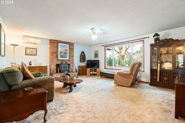 carpeted living room featuring a textured ceiling, ceiling fan, a wall mounted air conditioner, and a wood stove