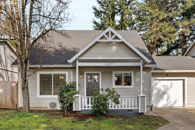 view of front of home with a garage, a shingled roof, concrete driveway, covered porch, and ac unit