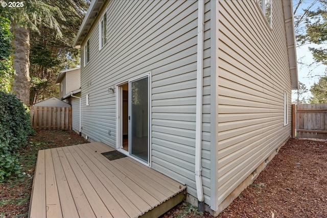 view of home's exterior with a fenced backyard and a deck