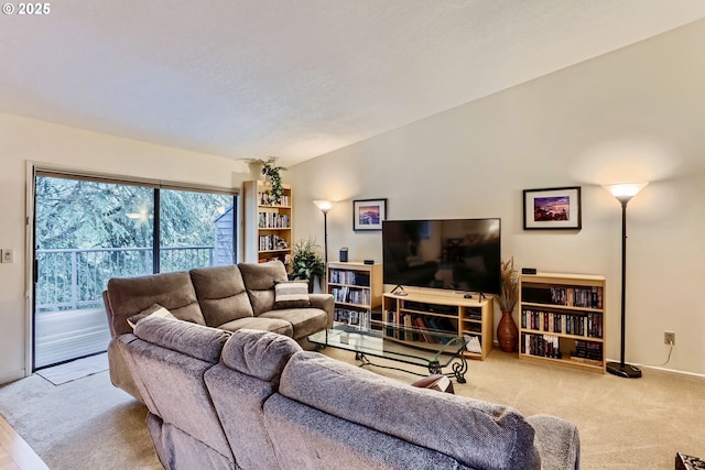 living room with light colored carpet and lofted ceiling