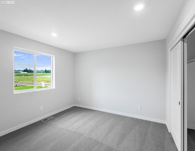 18960 SW Eureka Ln, Beaverton, OR 97007 - unfurnished bedroom with dark carpet, recessed lighting, a closet, and baseboards