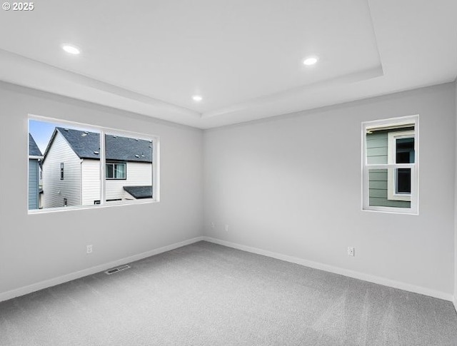 18960 SW Eureka Ln, Beaverton, OR 97007 - carpeted spare room featuring a tray ceiling, recessed lighting, and baseboards