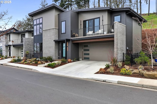 contemporary home featuring concrete driveway, a garage, fence, and brick siding