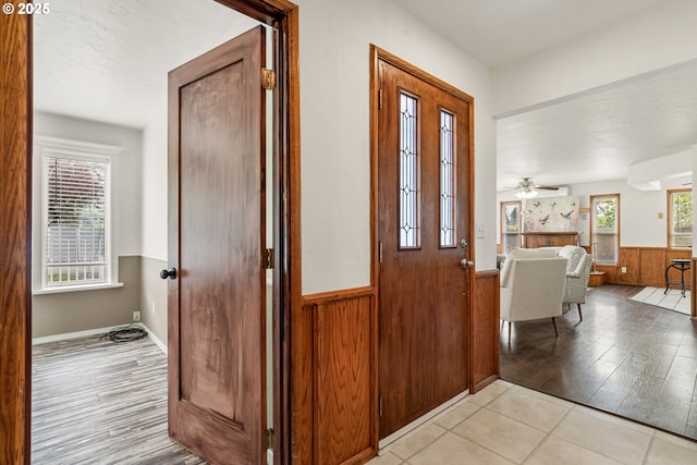 409 Pacific Ave, Brookings, OR 97415 - entryway with wainscoting, light wood-type flooring, and wooden walls