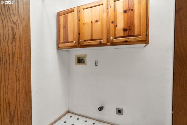 409 Pacific Ave, Brookings, OR 97415 - washroom with cabinet space, electric dryer hookup, washer hookup, baseboards, and light flooring