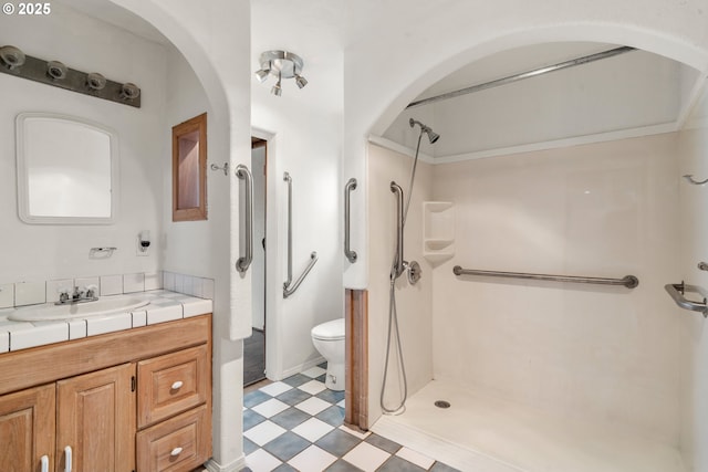 409 Pacific Ave, Brookings, OR 97415 - full bath with tile patterned floors, toilet, a shower, and vanity