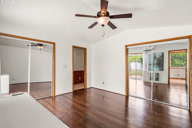 409 Pacific Ave, Brookings, OR 97415 - unfurnished bedroom with lofted ceiling, multiple windows, wood finished floors, and ceiling fan