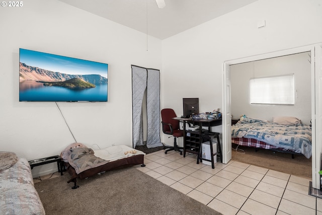 409 Pacific Ave, Brookings, OR 97415 - bedroom featuring light tile patterned flooring, light carpet, and a ceiling fan