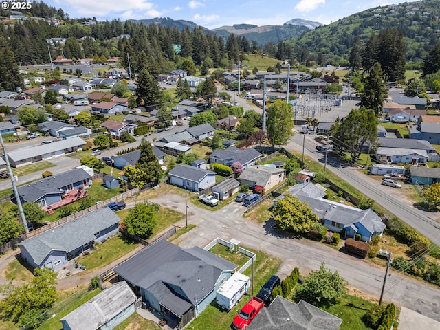409 Pacific Ave, Brookings, OR 97415 - aerial view of residential area with mountains and a forest