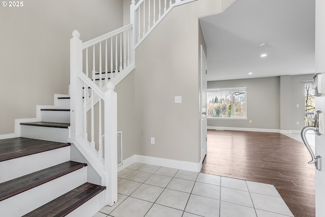 stairs with hardwood / wood-style floors