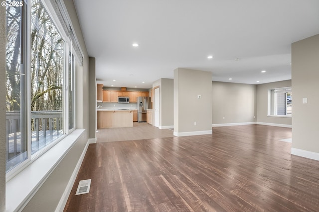 unfurnished living room featuring light hardwood / wood-style floors