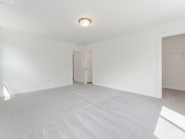 2307 SW 5th Pl, Battle Ground, WA 98604 - unfurnished bedroom with carpet flooring, a walk in closet, and a closet