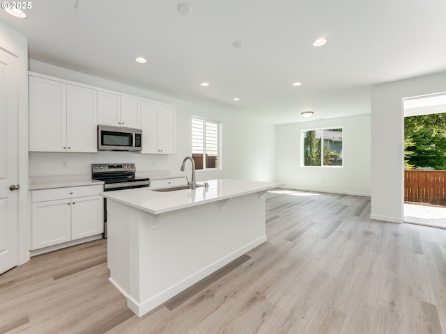 2307 SW 5th Pl, Battle Ground, WA 98604 - kitchen featuring stainless steel appliances, a sink, healthy amount of natural light, and recessed lighting