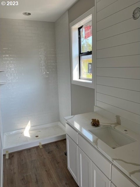 486 Meadows Dr, Manzanita, OR 97130 - bathroom with wood finished floors, vanity, and a shower