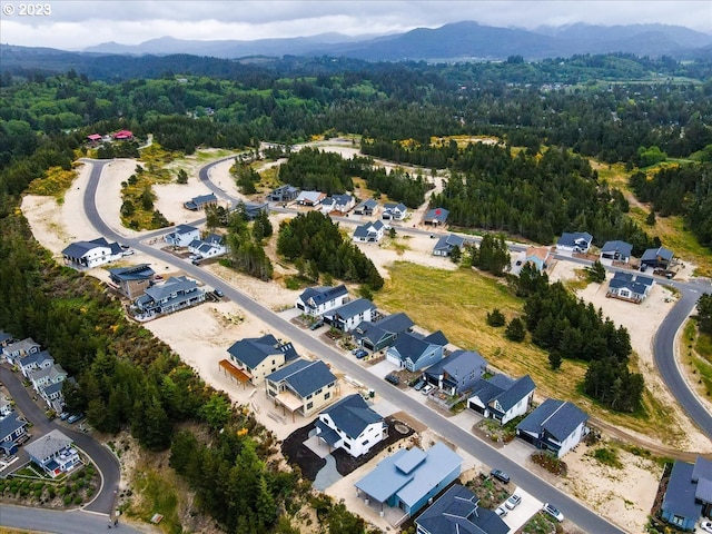 486 Meadows Dr, Manzanita, OR 97130 - aerial view of property's location featuring a mountainous background and nearby suburban area