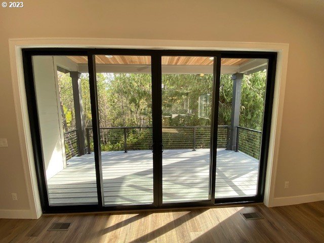 486 Meadows Dr, Manzanita, OR 97130 - entryway featuring baseboards and wood finished floors