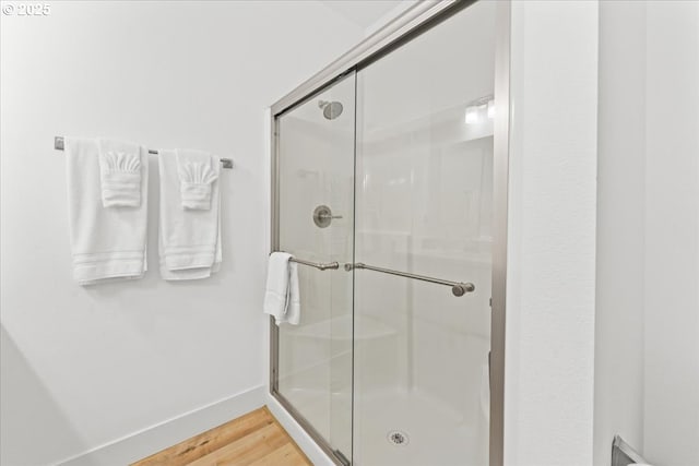 531 NW Vancouver Ave, Stevenson, WA 98648 - full bath featuring a shower stall, wood finished floors, and baseboards