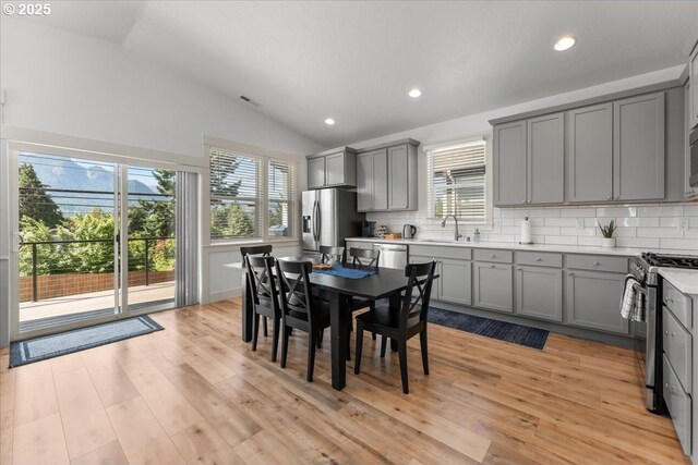 531 NW Vancouver Ave, Stevenson, WA 98648 - dining area with vaulted ceiling, light wood finished floors, and recessed lighting