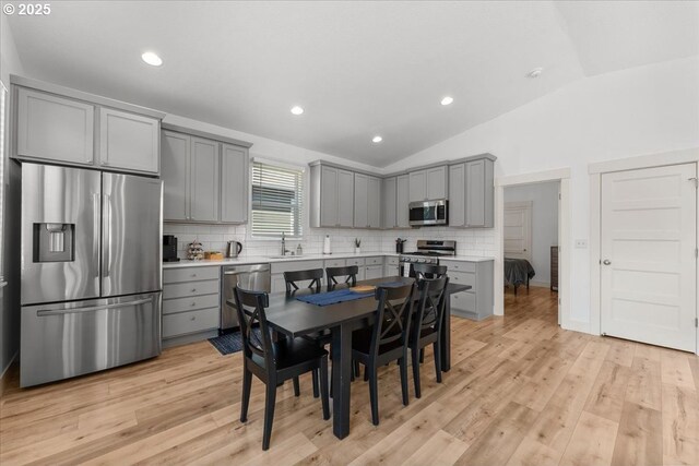 531 NW Vancouver Ave, Stevenson, WA 98648 - dining room with vaulted ceiling, light wood-style flooring, and recessed lighting