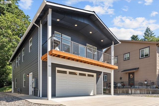 531 NW Vancouver Ave, Stevenson, WA 98648 - view of front of property with a balcony, driveway, and an attached garage