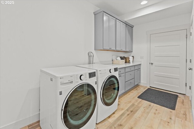 531 NW Vancouver Ave, Stevenson, WA 98648 - laundry room with washing machine and clothes dryer, cabinet space, light wood-style floors, baseboards, and recessed lighting