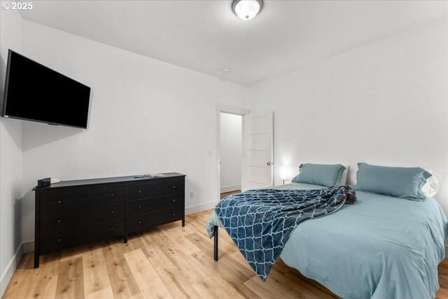 531 NW Vancouver Ave, Stevenson, WA 98648 - bedroom featuring light wood-style floors and baseboards